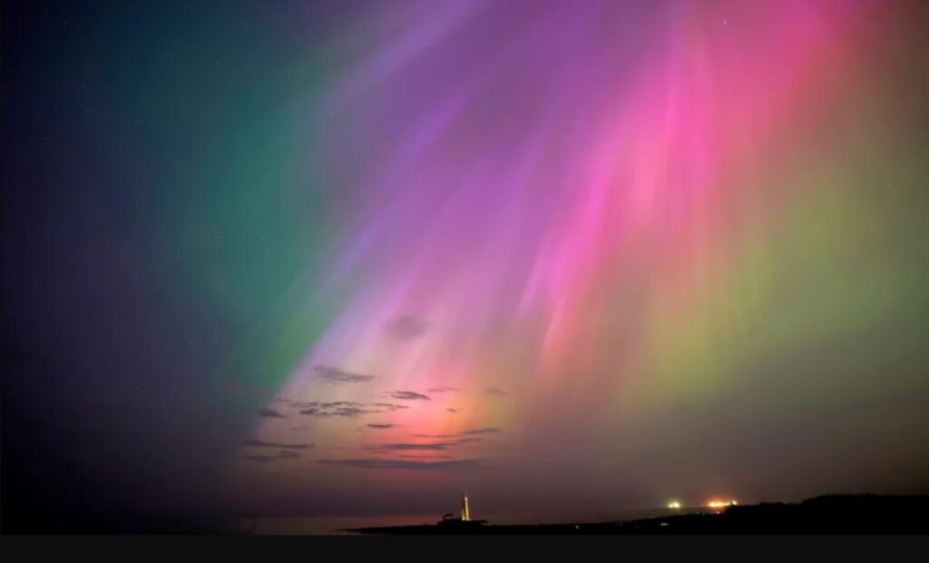 The aurora borealis glow on the horizon at St Mary's Lighthouse, Whitley Bay
Courtesy: PA media